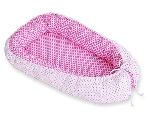 Réducteur de lit bébé rose