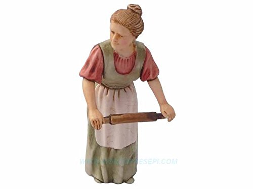 Femme qui spenna avec rouleau à pâtisserie 10 c...